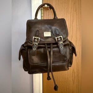 Steve Madden NYC Women’s Buckle Flap Backpack in a rich brown faux leather